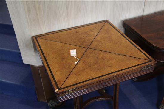 A pair of ebony strung burr walnut envelope card tables, W.1ft 11in. D.1ft 11in. H.2ft 5in.